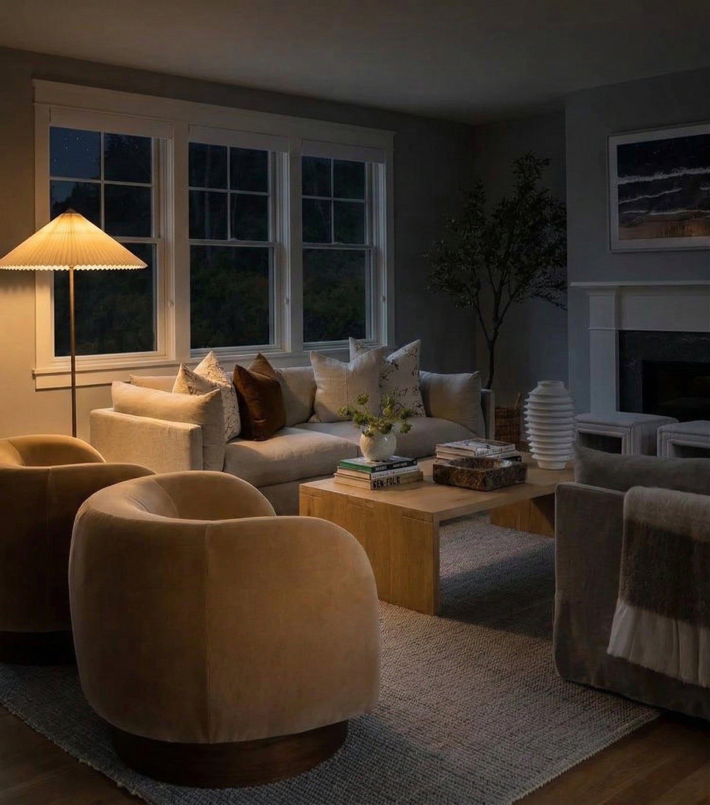 Cozy living room with beige armchairs, a coffee table, and decorative items.