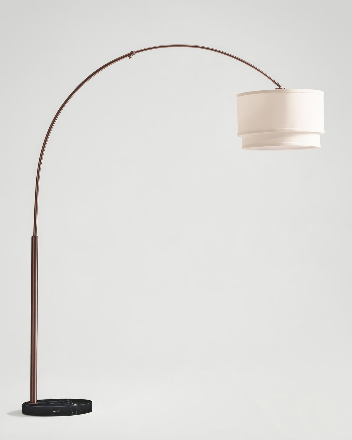 Dark bronze Brightech Mason arc floor lamp with a double drum shade on a black marble base, on a light grey background